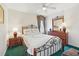 Bedroom features a queen bed, two nightstands and a large mirror at 1207 Winding Cypress Ct, Kissimmee, FL 34746