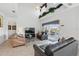 Bright living room featuring tile floors, vaulted ceilings, and sliding glass doors to the pool area at 1207 Winding Cypress Ct, Kissimmee, FL 34746