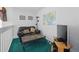 Comfortable loft with a map and a comfortable couch, providing a cozy space for relaxing and entertainment at 1207 Winding Cypress Ct, Kissimmee, FL 34746
