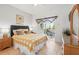 Bright bedroom with sliding glass doors leading to patio for a seamless indoor-outdoor experience at 1207 Winding Cypress Ct, Kissimmee, FL 34746