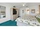 Bright bedroom featuring a tropical bedspread and a bathroom ensuite for added convenience at 1207 Winding Cypress Ct, Kissimmee, FL 34746