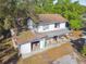 Aerial view of a two-story home showing the roof, backyard, detached garage, and covered porch at 100 N Main St, Winter Garden, FL 34787