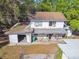 A beautiful aerial view showcasing the back of the home and detached garage at 100 N Main St, Winter Garden, FL 34787