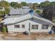 A view showing the back of the home and the bare yard at 100 N Main St, Winter Garden, FL 34787