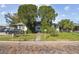 Charming home with mature trees, green lawn, and brick street at 100 N Main St, Winter Garden, FL 34787