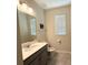 Bathroom features a single sink vanity and a decorative wall hanging at 10079 Memoir Ave, Winter Garden, FL 34787