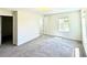 Bedroom has carpet, a window with blinds, and two doors leading to other rooms at 10079 Memoir Ave, Winter Garden, FL 34787