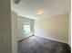 Bedroom featuring neutral walls, carpet flooring, and a window with blinds at 10079 Memoir Ave, Winter Garden, FL 34787
