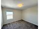 Bedroom featuring neutral walls, carpet flooring, and a single window at 10079 Memoir Ave, Winter Garden, FL 34787