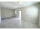 Bright, open living space features tiled floors and two windows letting in ample natural light at 10079 Memoir Ave, Winter Garden, FL 34787