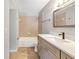 Stylish bathroom featuring a double sink vanity, bathtub, and modern fixtures at 11568 Westwood Blvd # 1021, Orlando, FL 32821