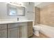 Bathroom with updated vanity with countertop, bathtub, and tiled shower at 11568 Westwood Blvd # 1021, Orlando, FL 32821