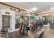 Well-equipped gym featuring modern exercise machines, dumbbells, and mirrors for a complete fitness experience at 11568 Westwood Blvd # 1021, Orlando, FL 32821