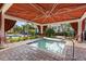 Relaxing hot tub under a covered gazebo, perfect for unwinding in a serene outdoor setting near the pool at 11568 Westwood Blvd # 1021, Orlando, FL 32821