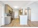 Contemporary kitchen showcasing stainless steel appliances, light cabinets, and stylish flooring at 11568 Westwood Blvd # 1021, Orlando, FL 32821