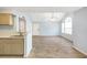 Inviting living room and kitchen area with vaulted ceilings and seamless flooring at 11568 Westwood Blvd # 1021, Orlando, FL 32821