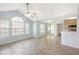 Bright, open-concept living room with vaulted ceilings and wood-style flooring at 11568 Westwood Blvd # 1021, Orlando, FL 32821