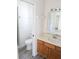 Bright bathroom featuring a toilet, sink and walk-in shower at 11847 Ocklawaha Dr, Leesburg, FL 34788