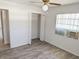 This bedroom features new flooring, light colored walls and ceilings, and a closet at 11847 Ocklawaha Dr, Leesburg, FL 34788