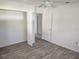 This bedroom features new flooring, light colored walls and ceilings, and a closet at 11847 Ocklawaha Dr, Leesburg, FL 34788