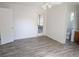 Spacious bedroom with wood flooring, ceiling fan, and ensuite bathroom and outdoor access at 11847 Ocklawaha Dr, Leesburg, FL 34788