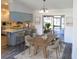 Stylish dining area adjacent to the kitchen, featuring modern decor and sliding glass doors at 11847 Ocklawaha Dr, Leesburg, FL 34788