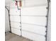 Garage door featuring a multi-panel design and secure hardware at 11847 Ocklawaha Dr, Leesburg, FL 34788
