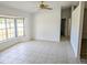 Spacious living room with a ceiling fan and large bay window at 11847 Ocklawaha Dr, Leesburg, FL 34788