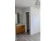 Main bedroom leads to bathroom and features new floors, light colored walls and ceilings, closet at 11847 Ocklawaha Dr, Leesburg, FL 34788