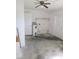 The utility room with a water heater, doors, and concrete flooring at 11847 Ocklawaha Dr, Leesburg, FL 34788