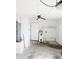 The utility room with a water heater, doors, and concrete flooring at 11847 Ocklawaha Dr, Leesburg, FL 34788