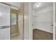 Bathroom featuring a walk-in shower with tiled walls and a view to a walk-in closet with wire shelving at 119 Winterglen Dr Dr, Sanford, FL 32771