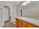 Bathroom featuring vanity with a large mirror, toilet, and a doorway to the shower/tub at 119 Winterglen Dr Dr, Sanford, FL 32771