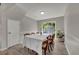 Dining room featuring a white table, six chairs, and a sliding glass door to the backyard at 119 Winterglen Dr Dr, Sanford, FL 32771