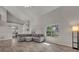 Spacious living room with lots of natural light and a large sectional sofa at 119 Winterglen Dr Dr, Sanford, FL 32771