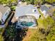Aerial view of a home with a screened-in pool and fenced-in backyard, offering great privacy at 1367 Saddleridge Dr, Orlando, FL 32835