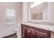 Bathroom features a dark wood vanity with granite countertops and a well-lit mirror above the sink at 1367 Saddleridge Dr, Orlando, FL 32835