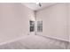 The bedroom includes gray carpet, high ceilings, and windows at 1367 Saddleridge Dr, Orlando, FL 32835