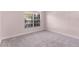 Bedroom featuring a neutral color palette, cozy gray carpet, and natural light at 1367 Saddleridge Dr, Orlando, FL 32835