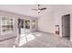 Bedroom with vaulted ceilings, ceiling fan, and access to the outdoor patio at 1367 Saddleridge Dr, Orlando, FL 32835