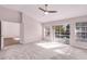 Bedroom with vaulted ceilings, ceiling fan, and sliding glass door leading to a pool at 1367 Saddleridge Dr, Orlando, FL 32835