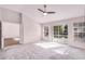 Bedroom with vaulted ceilings, ceiling fan, and sliding glass door leading to a pool at 1367 Saddleridge Dr, Orlando, FL 32835
