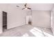 Large bedroom with an open door, ceiling fan, and carpet at 1367 Saddleridge Dr, Orlando, FL 32835
