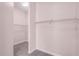 Walk-in closet with shelving and neutral-colored carpeting at 1367 Saddleridge Dr, Orlando, FL 32835