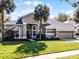 Charming single Gathering home with well-manicured lawn and attractive archway entryway at 1367 Saddleridge Dr, Orlando, FL 32835