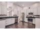 Spacious kitchen features stainless steel appliances, white cabinets, and dark granite countertops at 1367 Saddleridge Dr, Orlando, FL 32835