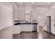Bright kitchen with stainless steel appliances, white cabinetry, and dark countertops at 1367 Saddleridge Dr, Orlando, FL 32835