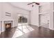 Spacious living room with dark floors, a fireplace, and large windows offering natural light at 1367 Saddleridge Dr, Orlando, FL 32835