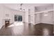 Open living room featuring a fireplace, vaulted ceilings, and sliding doors to the outdoor space at 1367 Saddleridge Dr, Orlando, FL 32835