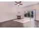 Bright living room with a fireplace and access to the screened-in pool area at 1367 Saddleridge Dr, Orlando, FL 32835